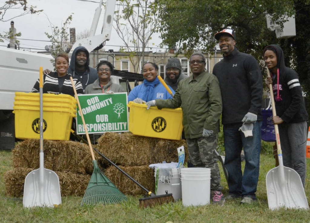Photo of people participating in a Baltimore community cleanup event from diStefano's Arts For Learning introductory video